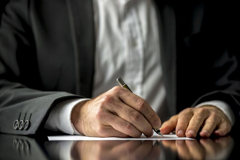 man signing letter, Congress to provide permanent protection for Dreamers