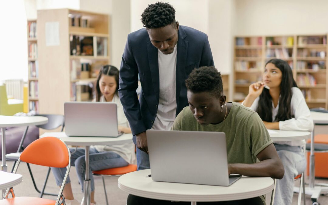 College Professor reviewing students work